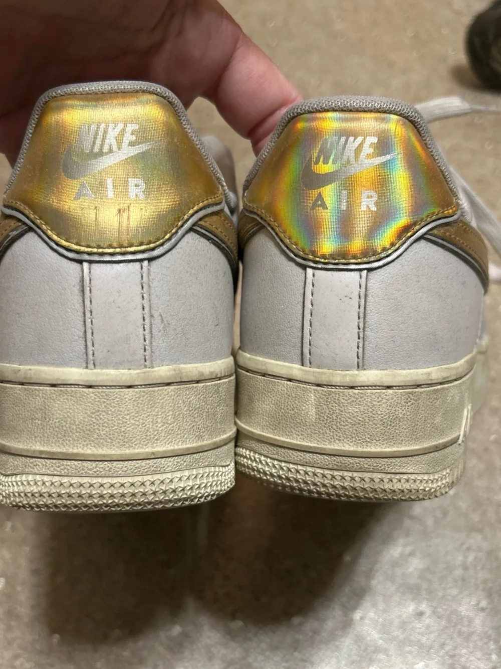 Nike White Athletic Shoes with Gold Swoosh
